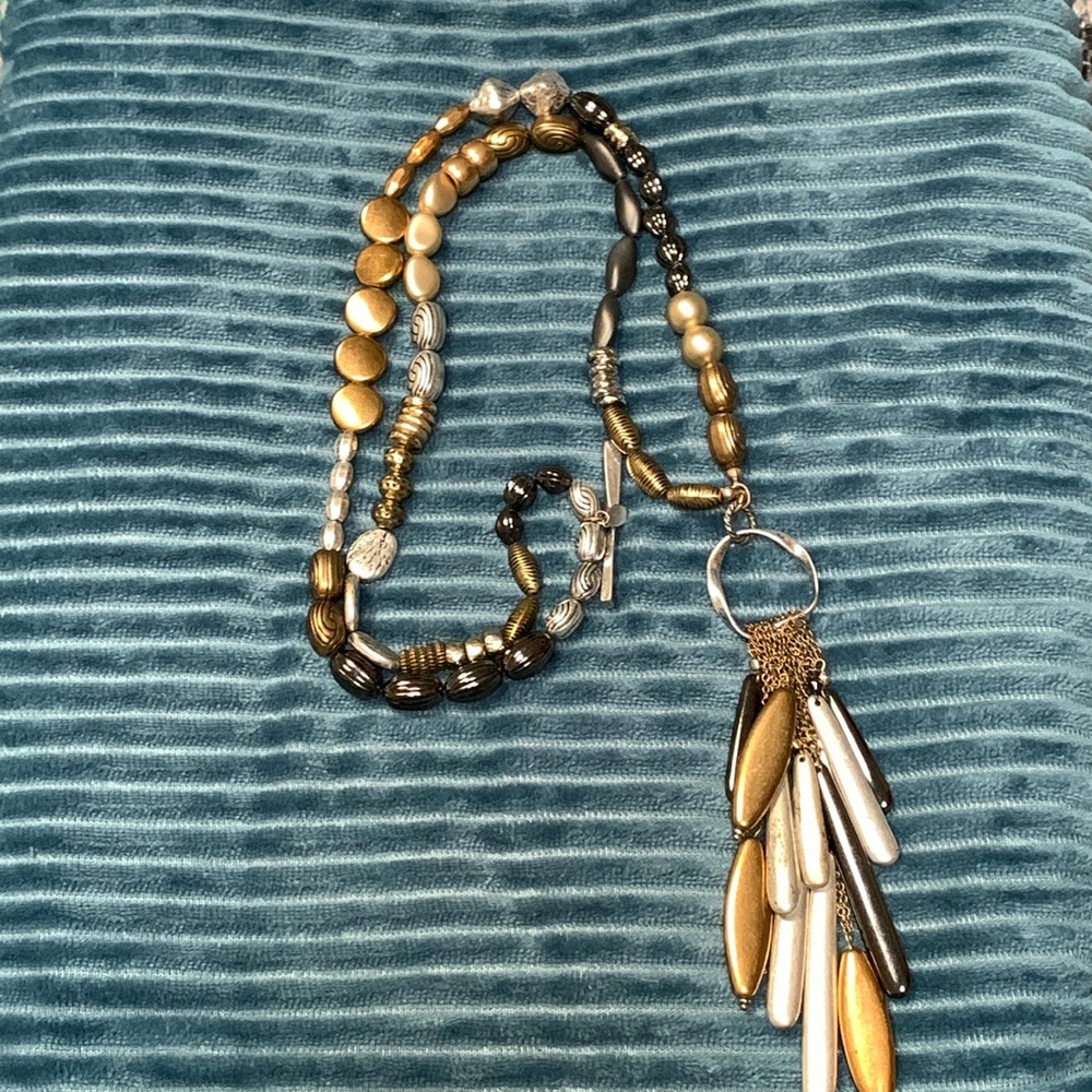 Multiple metal colored beaded necklace.  24 inches in length.